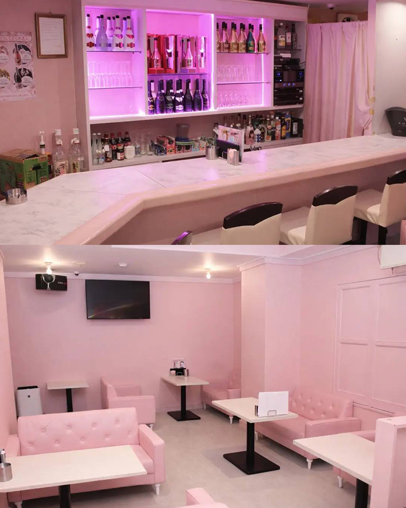 PINK MONSTER 堺店 店内(ネオンが光るピンクのバーカウンターと、ピンクのソファ席)